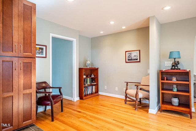 sitting room with light hardwood / wood-style floors