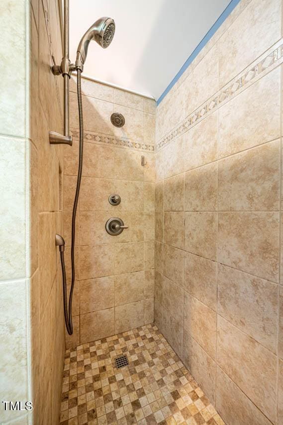 bathroom with a tile shower