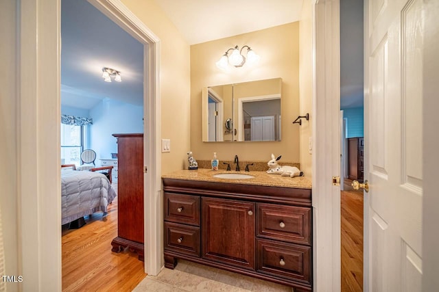 bathroom with vanity and hardwood / wood-style flooring