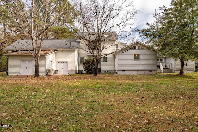 back of property featuring a yard