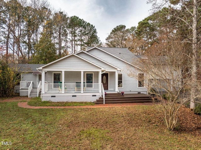 view of front of home featuring a front yard and a porch