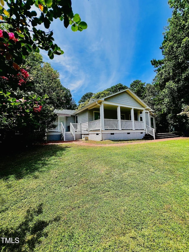 135 Weatherbend, Pittsboro, NC 27312 - view of front of house with crawl space, covered porch, and a front lawn