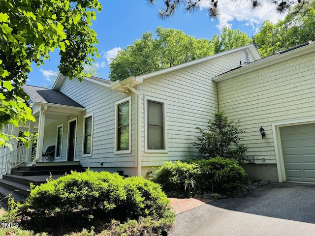 135 Weatherbend, Pittsboro, NC 27312 - view of home's exterior with a garage and a porch