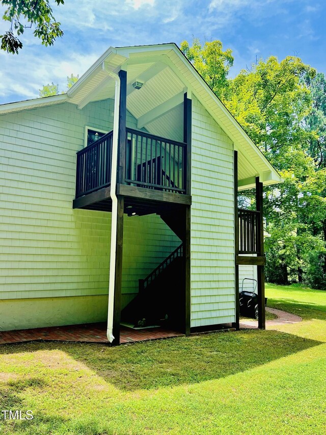 135 Weatherbend, Pittsboro, NC 27312 - view of side of property featuring a balcony and a yard