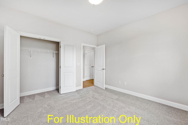 unfurnished bedroom featuring light colored carpet and a closet