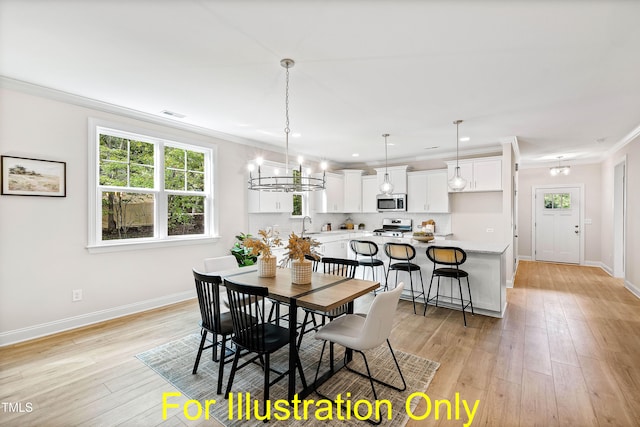 dining area with sink, crown molding, light hardwood / wood-style flooring, and a chandelier