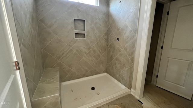 bathroom featuring tiled shower