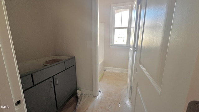 bathroom with vanity and independent shower and bath