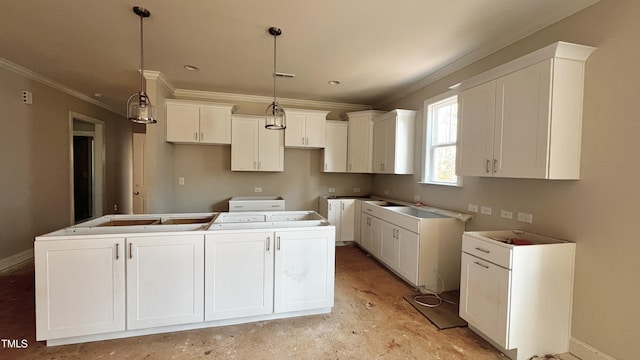 kitchen with hanging light fixtures, crown molding, a center island, and white cabinets