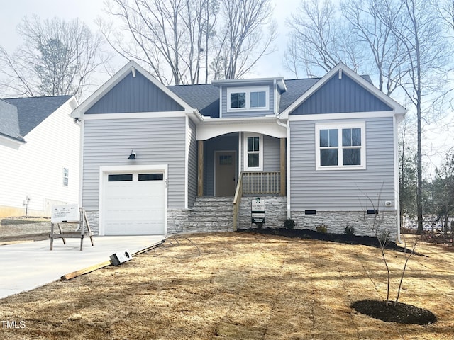 view of front of property featuring driveway, a porch, board and batten siding, an attached garage, and crawl space