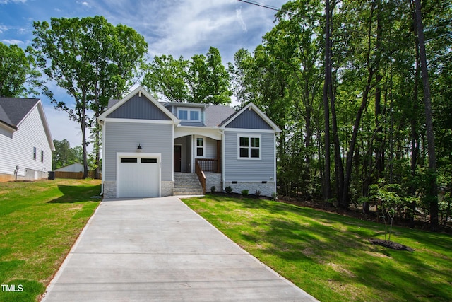 craftsman-style home featuring a garage, a front lawn, driveway, and crawl space