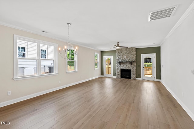 unfurnished living room with crown molding, visible vents, wood finished floors, and ceiling fan with notable chandelier