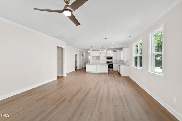 unfurnished living room featuring crown molding, baseboards, light wood-style flooring, and ceiling fan with notable chandelier