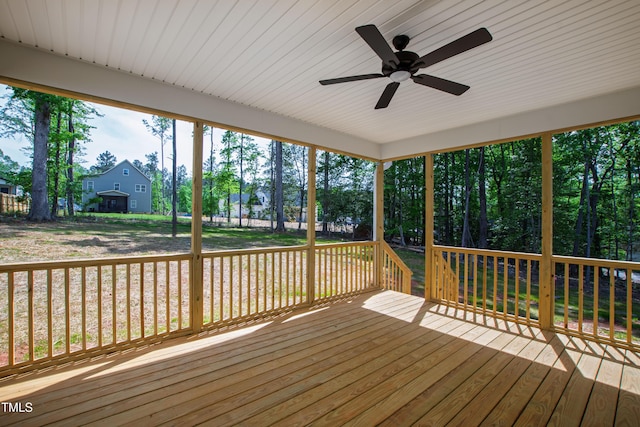 wooden terrace with a ceiling fan
