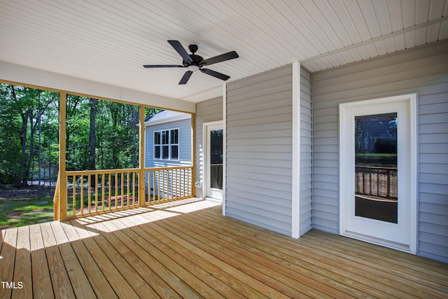 wooden terrace featuring ceiling fan