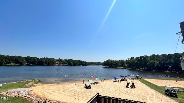 property view of water featuring a forest view