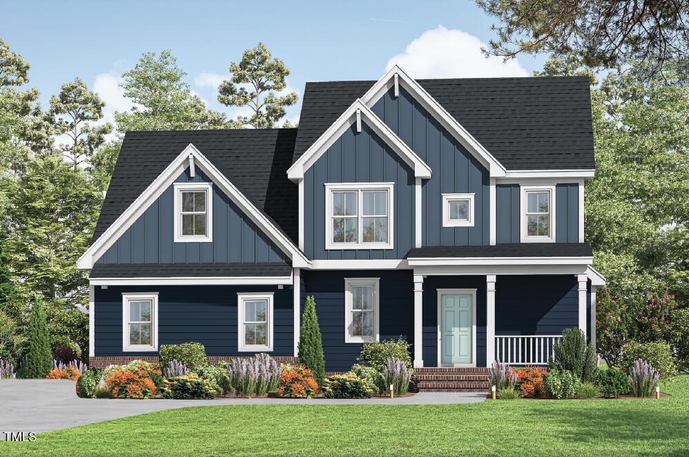 craftsman inspired home featuring a porch and a front lawn