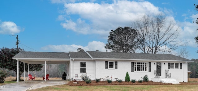 single story home with a carport and a front yard