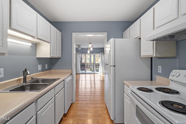 kitchen featuring white cabinetry, sink, white appliances, and custom range hood