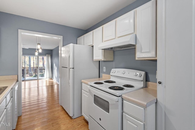 kitchen featuring pendant lighting, white cabinetry, white appliances, and light hardwood / wood-style flooring