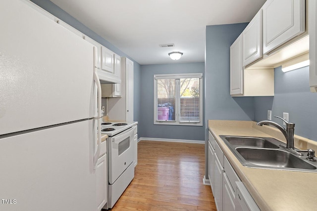 kitchen featuring white cabinets, light wood-type flooring, white appliances, and sink