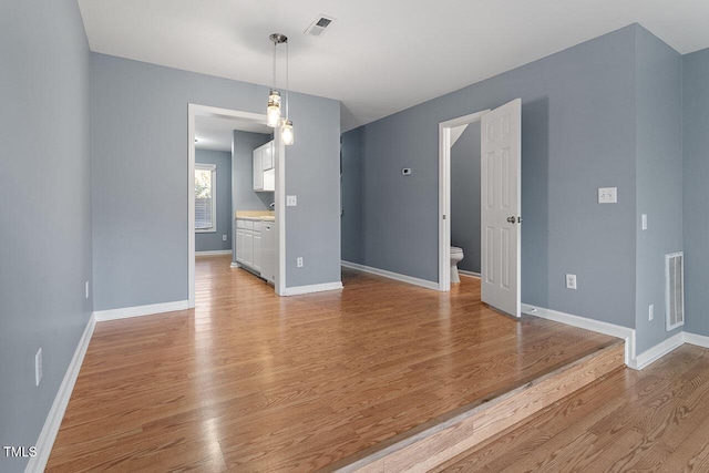 unfurnished room featuring light hardwood / wood-style floors