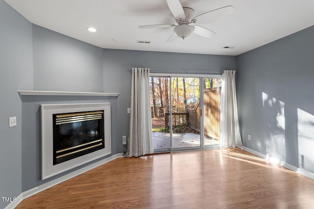 unfurnished living room featuring light hardwood / wood-style floors and ceiling fan