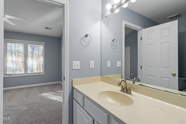 bathroom featuring vanity and ceiling fan