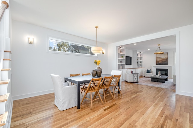 dining area with light hardwood / wood-style flooring