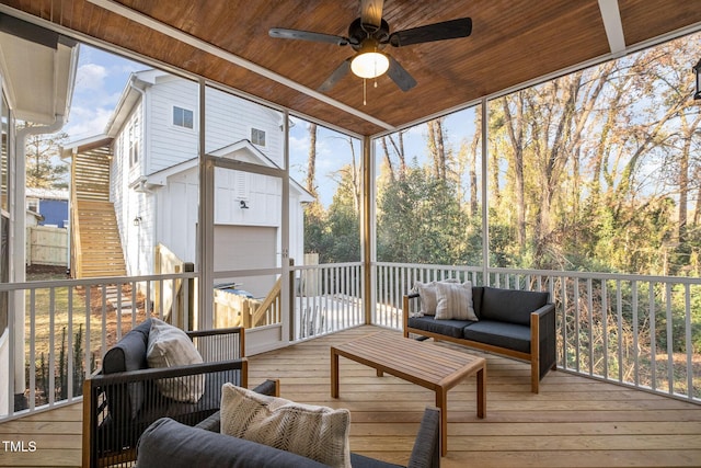 sunroom / solarium with ceiling fan and wooden ceiling