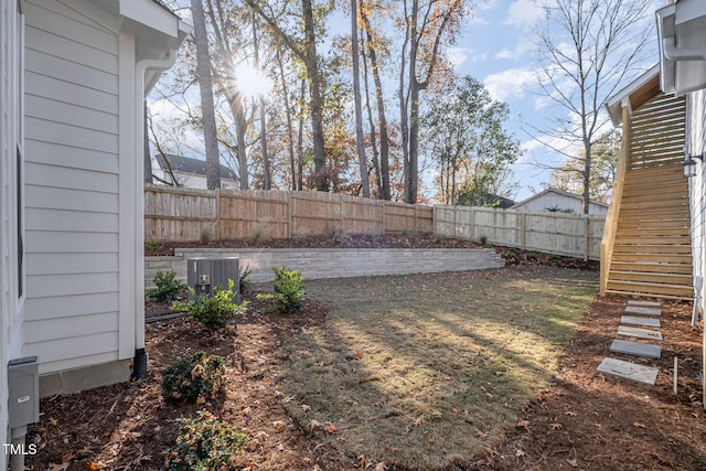 view of yard featuring central AC unit