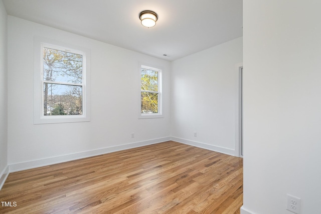 spare room with light hardwood / wood-style floors