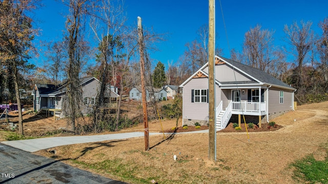 view of front of home with a porch and a front lawn