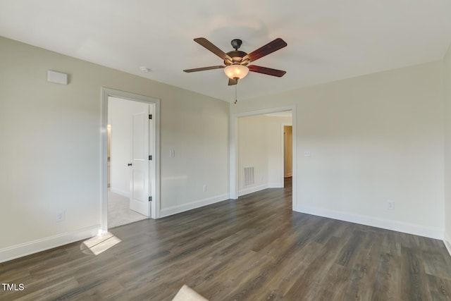 unfurnished room featuring ceiling fan and dark hardwood / wood-style floors