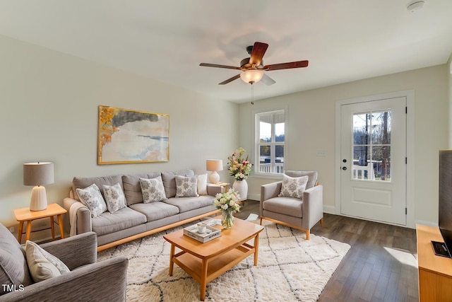 living room featuring dark hardwood / wood-style flooring, plenty of natural light, and ceiling fan