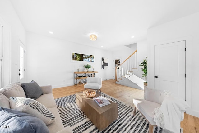 living room with light hardwood / wood-style flooring