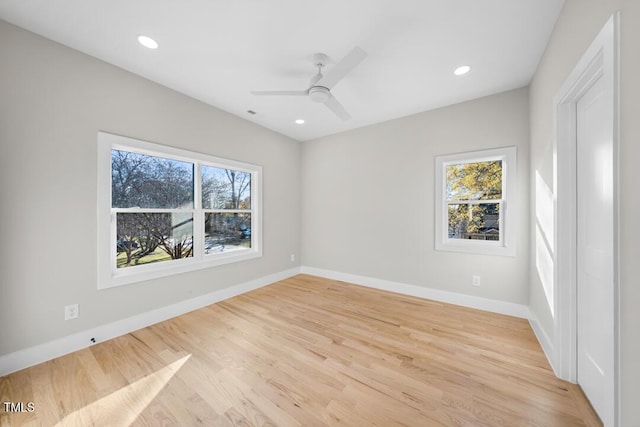 spare room with ceiling fan and light hardwood / wood-style flooring