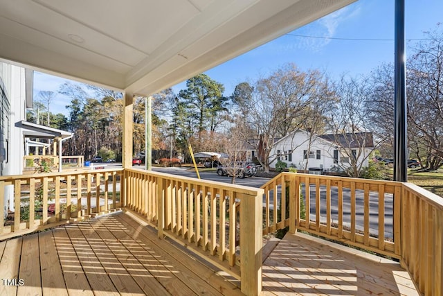 wooden terrace with a porch