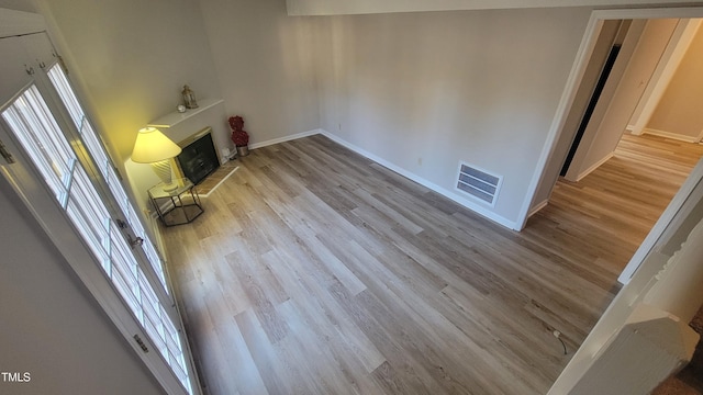 unfurnished living room with light hardwood / wood-style floors