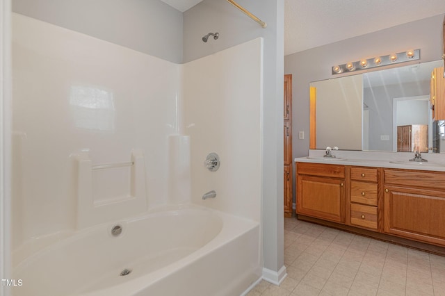 bathroom with vanity and a textured ceiling