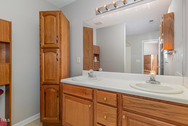 bathroom featuring tile patterned floors and vanity