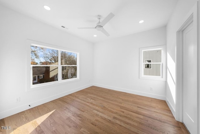 spare room featuring ceiling fan and light hardwood / wood-style floors