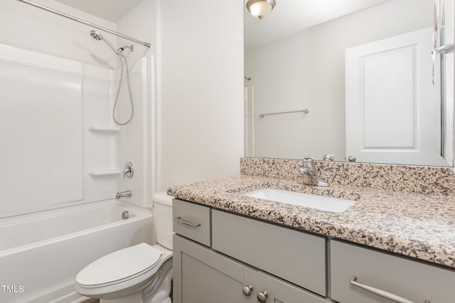 full bathroom with toilet, vanity, and tub / shower combination