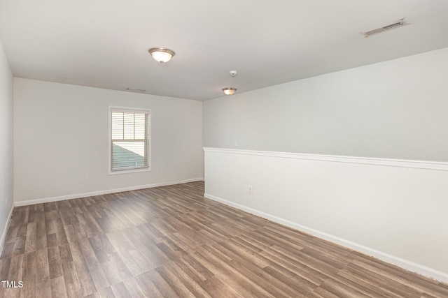 empty room featuring hardwood / wood-style floors