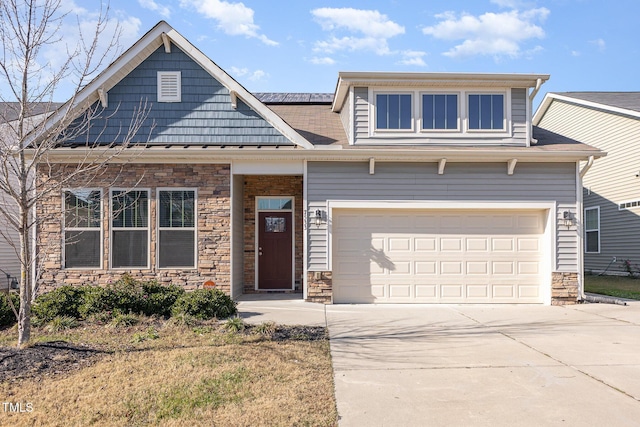 view of front of house with solar panels and a garage