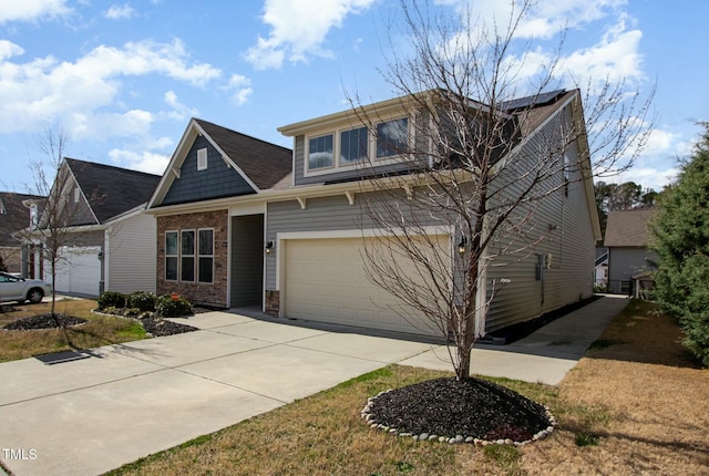 craftsman house featuring a garage and driveway