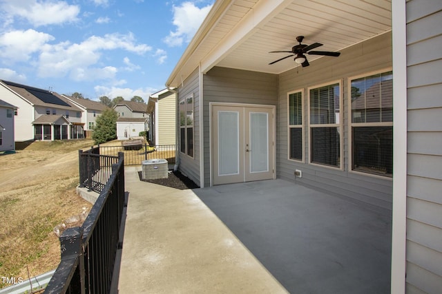 view of patio featuring a residential view, french doors, and ceiling fan