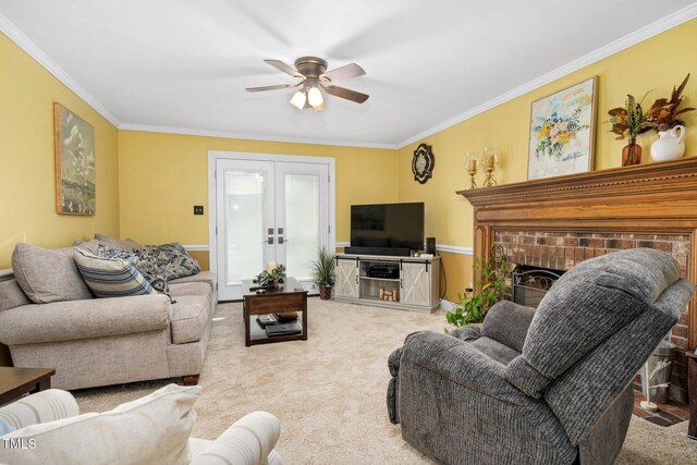 carpeted living room with ceiling fan, french doors, and ornamental molding