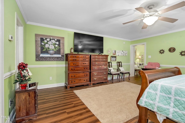 bedroom with dark wood-type flooring, ceiling fan, and crown molding