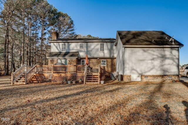 back of property with a wooden deck